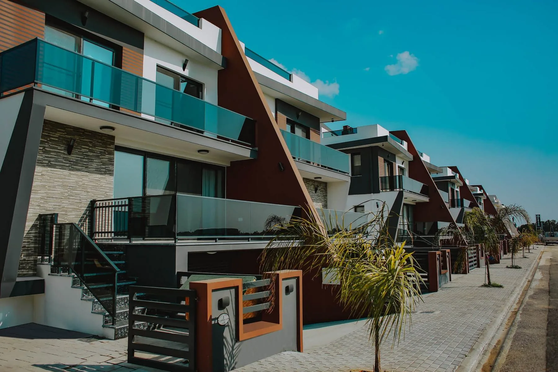 Independent Life triplex villas in Long Beach, İskele, with timber-clad gables